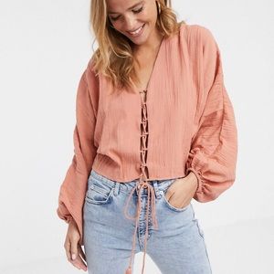 ASOS crop blouse with bell sleeves in a peachy pink colour